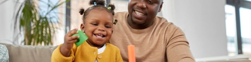 Father with Child playing in adventure zone which is our toddler zone 